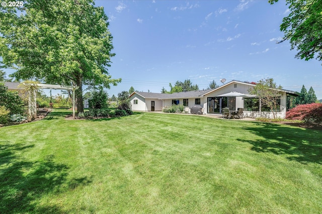 11700 S Makin Ln, Canby, OR 97013 - view of grassy yard featuring a patio area
