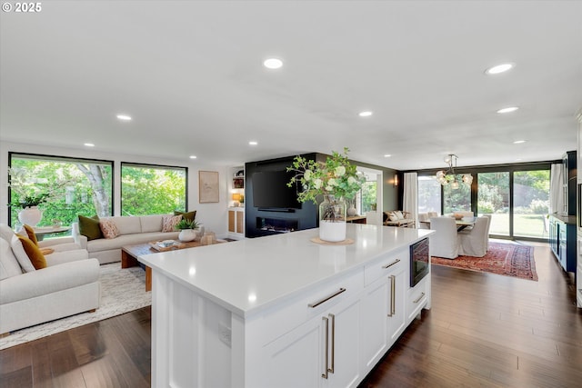 11700 S Makin Ln, Canby, OR 97013 - kitchen featuring black microwave, open floor plan, plenty of natural light, a kitchen island, and recessed lighting