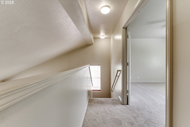 3980 Century Dr, Eugene, OR 97402 - corridor with carpet, vaulted ceiling, a textured ceiling, and an upstairs landing