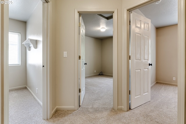 3980 Century Dr, Eugene, OR 97402 - hall with carpet floors and a textured ceiling