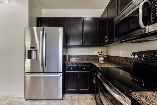 3980 Century Dr, Eugene, OR 97402 - kitchen featuring stainless steel appliances, dark cabinets, and dark stone counters