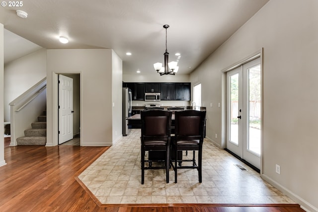 3980 Century Dr, Eugene, OR 97402 - dining space with a chandelier, stairs, recessed lighting, and light wood-type flooring