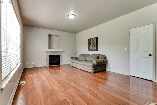 3980 Century Dr, Eugene, OR 97402 - living area featuring light wood finished floors and a tiled fireplace