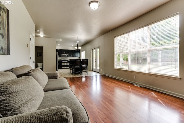 3980 Century Dr, Eugene, OR 97402 - living room featuring dark wood-style floors and baseboards