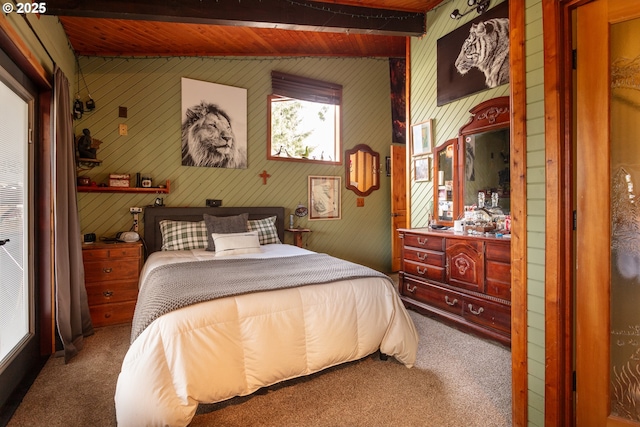 bedroom featuring vaulted ceiling with beams and carpet floors