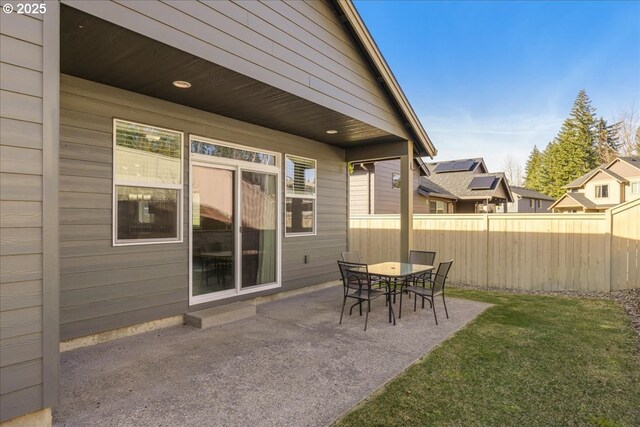 garage with stainless steel fridge and refrigerator