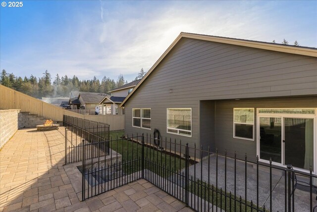 back of house featuring cooling unit, a patio area, and a lawn