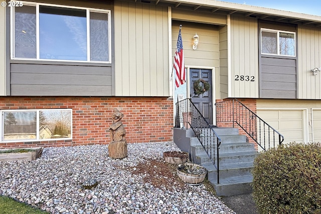 view of exterior entry featuring a garage