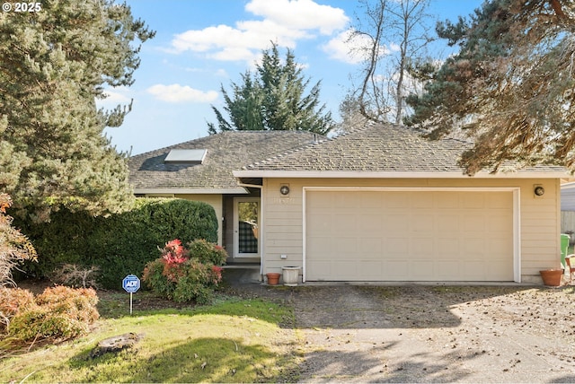 single story home with a garage