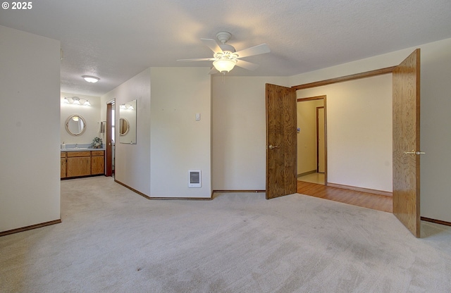 15798 SE 15th St, Vancouver, WA 98683 - unfurnished bedroom featuring light colored carpet, heating unit, ensuite bath, baseboards, and a textured ceiling