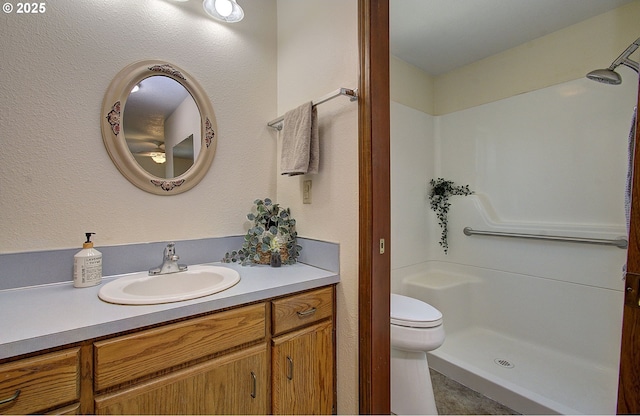 15798 SE 15th St, Vancouver, WA 98683 - bathroom with vanity, a shower, toilet, and a ceiling fan