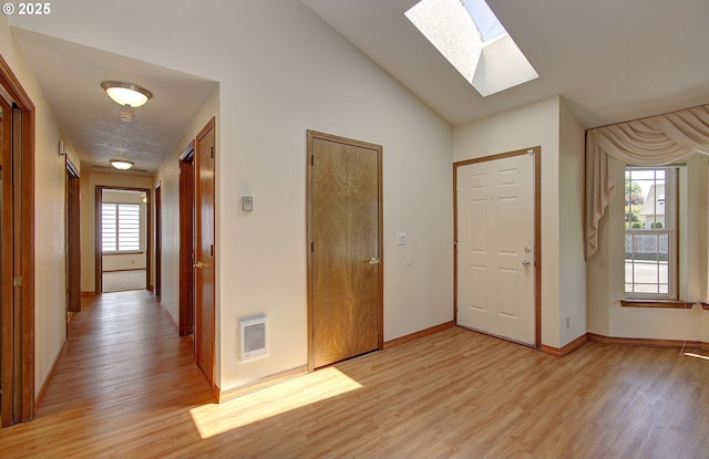 15798 SE 15th St, Vancouver, WA 98683 - foyer featuring a skylight, light wood finished floors, plenty of natural light, baseboards, and lofted ceiling