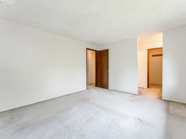 20621 SW Martinazzi Ave, Tualatin, OR 97062 - unfurnished room with light colored carpet and a textured ceiling