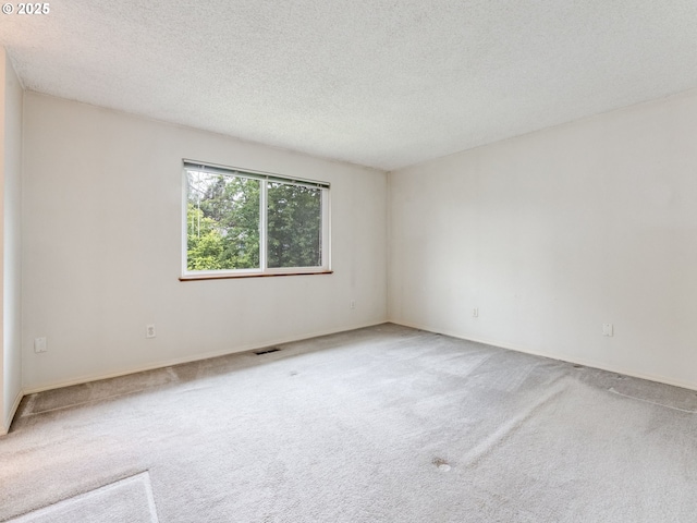 20621 SW Martinazzi Ave, Tualatin, OR 97062 - unfurnished room with carpet floors, a textured ceiling, and baseboards