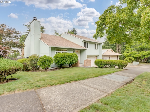 20621 SW Martinazzi Ave, Tualatin, OR 97062 - tri-level home featuring a chimney, a shingled roof, a front lawn, and a garage