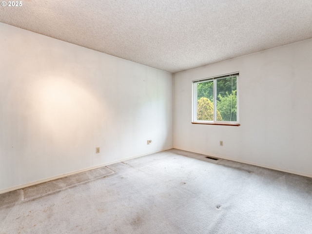 20621 SW Martinazzi Ave, Tualatin, OR 97062 - carpeted empty room featuring a textured ceiling and baseboards