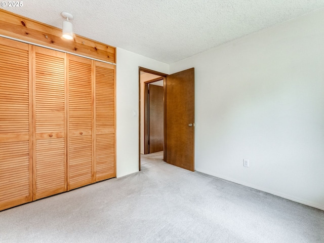 20621 SW Martinazzi Ave, Tualatin, OR 97062 - unfurnished bedroom featuring carpet flooring, a textured ceiling, and a closet