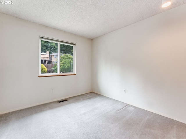 20621 SW Martinazzi Ave, Tualatin, OR 97062 - spare room featuring carpet floors, a textured ceiling, and baseboards