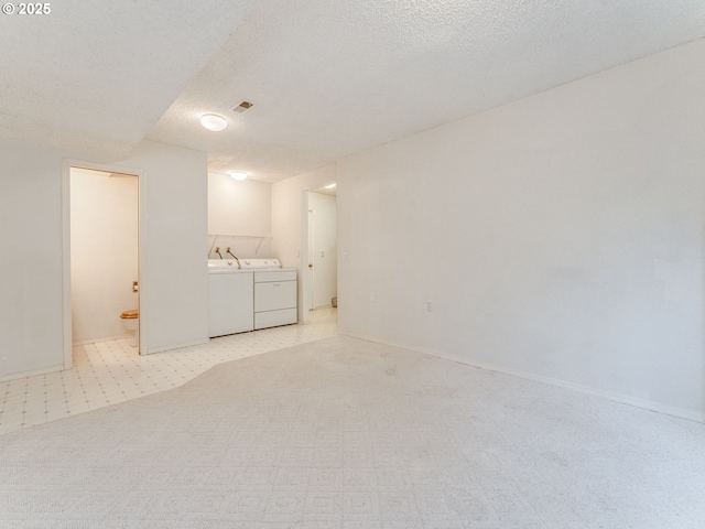 20621 SW Martinazzi Ave, Tualatin, OR 97062 - unfurnished room with separate washer and dryer, a textured ceiling, and baseboards
