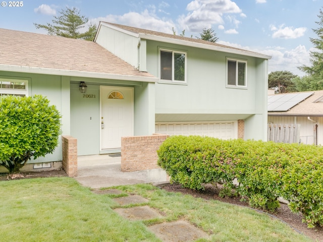 20621 SW Martinazzi Ave, Tualatin, OR 97062 - view of front of property featuring a shingled roof, a garage, stucco siding, and a front yard
