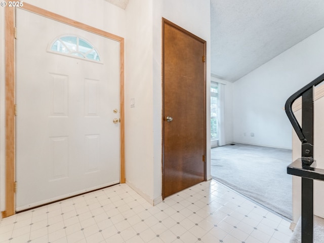 20621 SW Martinazzi Ave, Tualatin, OR 97062 - foyer featuring plenty of natural light, light carpet, baseboards, and lofted ceiling