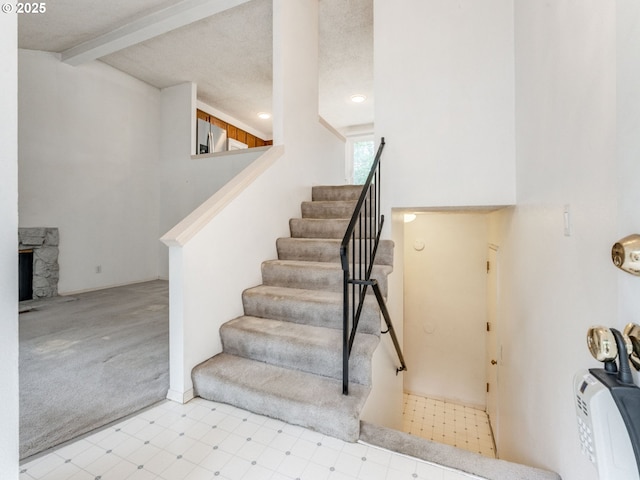 20621 SW Martinazzi Ave, Tualatin, OR 97062 - staircase with tile patterned floors, carpet, and recessed lighting