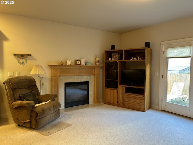 carpeted living room featuring a fireplace