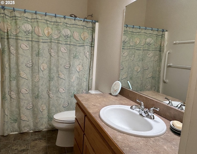 bathroom with tile patterned flooring, vanity, and toilet