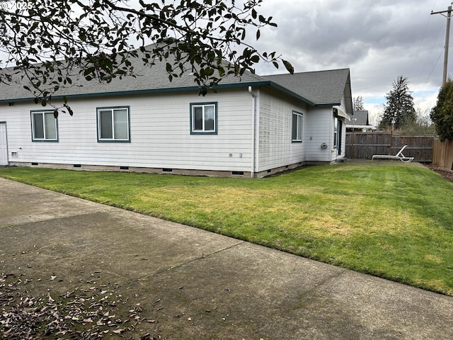 view of property exterior with a yard