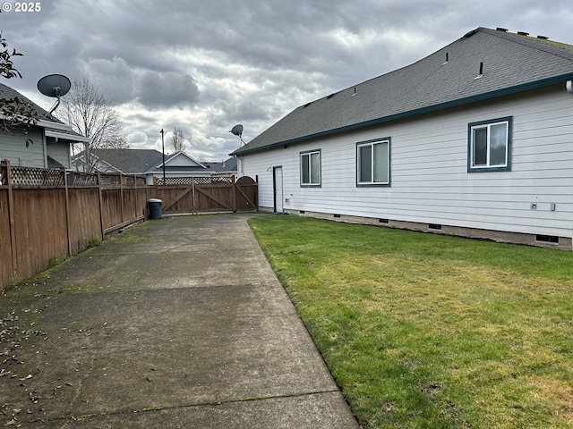 exterior space featuring a lawn and a patio area