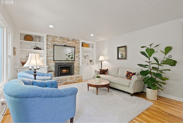 2927 Tolkien Ln, Lake Oswego, OR 97034 - living area with wood finished floors, built in features, a fireplace, and recessed lighting