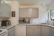 2237 SE 189th Ave, Portland, OR 97233 - kitchen featuring white dishwasher, gray cabinets, light countertops, and a sink