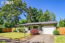 2237 SE 189th Ave, Portland, OR 97233 - view of front facade with an attached garage and asphalt driveway
