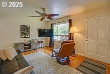 2237 SE 189th Ave, Portland, OR 97233 - living area with ceiling fan, wood finished floors, and baseboards