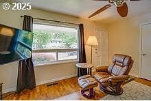 2237 SE 189th Ave, Portland, OR 97233 - living area with a ceiling fan, baseboards, and wood finished floors