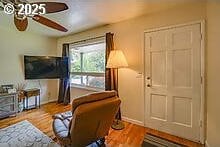 2237 SE 189th Ave, Portland, OR 97233 - living room featuring ceiling fan, wood finished floors, and baseboards