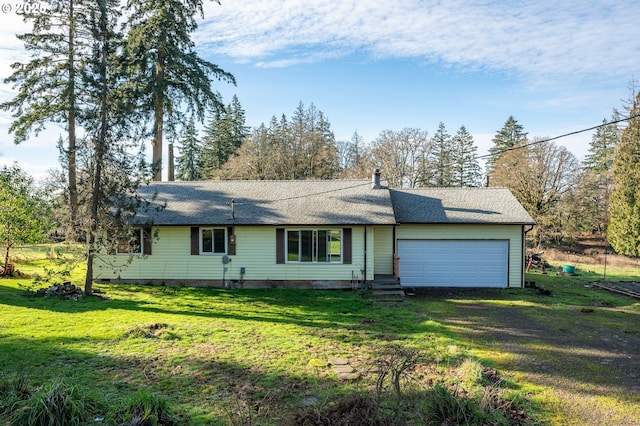 ranch-style home with a front yard and a garage