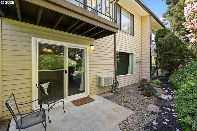 doorway to property with a balcony and a patio area