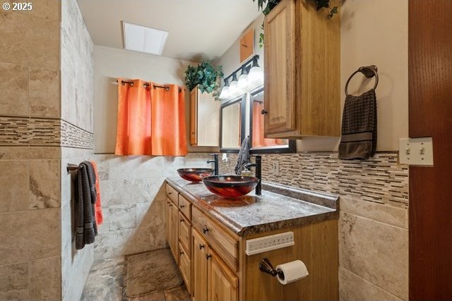 kitchen with sink and tile walls