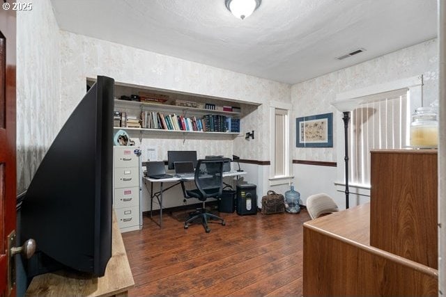 home office with dark wood-type flooring