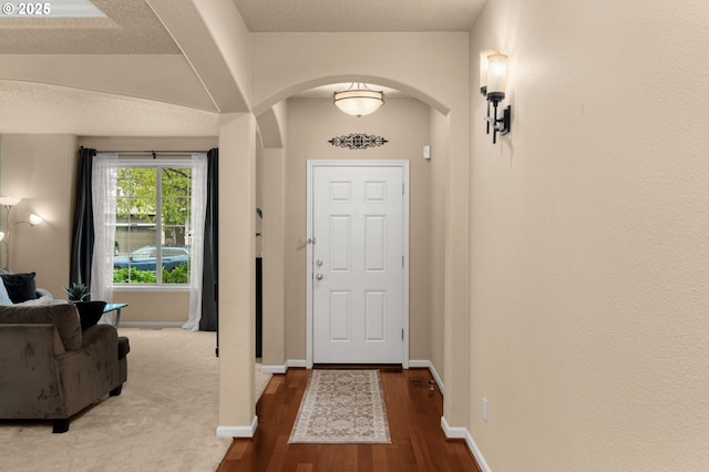 1116 Parkside Ave, Forest Grove, OR 97116 - entryway featuring arched walkways, wood finished floors, and baseboards