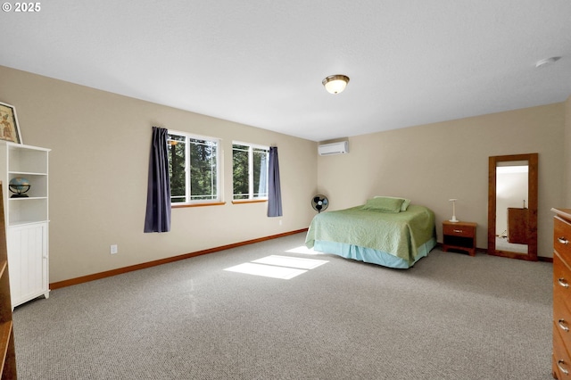 bedroom with baseboards, a wall mounted AC, and carpet
