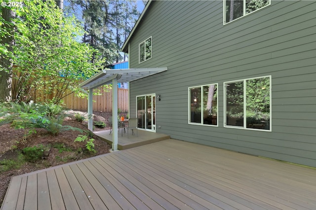 deck featuring a patio, fence, and a pergola