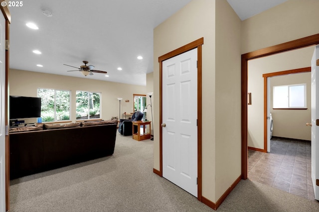 living room with baseboards, ceiling fan, light carpet, and recessed lighting