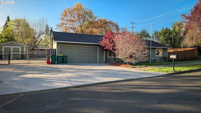 1502 Spring Garden Way, Forest Grove, OR 97116 - view of front of property with a chimney, an attached garage, fence, concrete driveway, and a storage shed