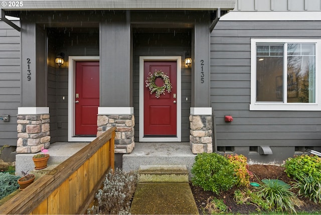 view of exterior entry with stone siding