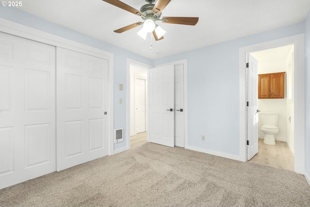 unfurnished bedroom with connected bathroom, baseboards, visible vents, and carpet flooring