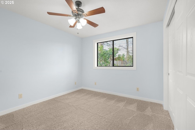 unfurnished bedroom featuring a closet, ceiling fan, baseboards, and carpet floors