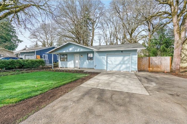 ranch-style house featuring a front lawn, concrete driveway, fence, and a garage