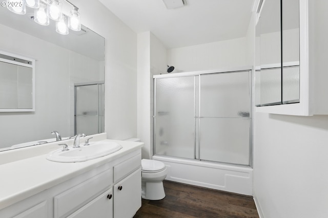 1571 NW Tanasbrook Ct, Beaverton, OR 97006 - full bath with wood finished floors, toilet, combined bath / shower with glass door, and vanity